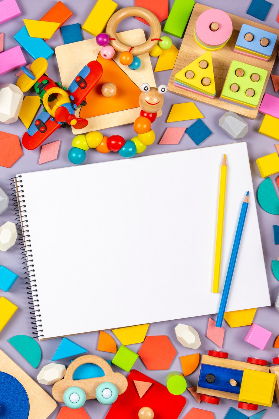 Colorful Wooden Plastic and Fluffy Toys and Blank Notebook